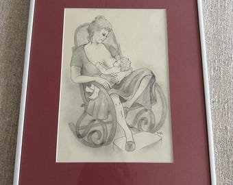 May include: A framed pencil sketch depicts a woman breastfeeding a baby while seated in a rocking chair. The artwork is framed with a white border and a maroon mat. The drawing is in grayscale.