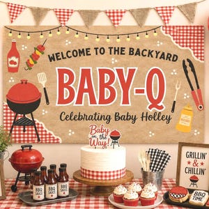 May include: A Baby-Q themed party display featuring a large banner with the text Welcome to the Backyard Baby-Q Celebrating Baby Holley, a white cake with a Baby on the Way topper, red and white balloons, BBQ sauce bottles, and signs.