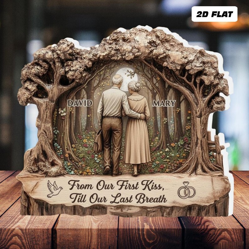 May include: A 2D flat wooden plaque featuring a couple walking in a forest scene. The plaque is inscribed with the names "David" and "Mary" and the phrase "From Our First Kiss, Till Our Last Breath." A dove and wedding rings are also depicted.