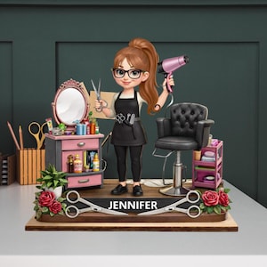 May include: A figurine of a hairstylist with a pink hair dryer and scissors. The figure is standing in front of a pink vanity with a mirror, a black salon chair, and a small shelf. The base has the name "Jennifer" and decorative scissors.