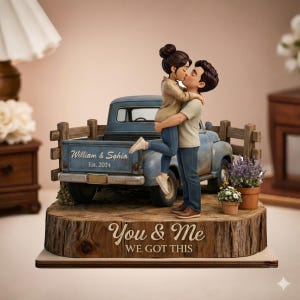 May include: A figurine of a couple kissing, standing in front of a blue vintage pickup truck. The truck bed has the text "William & Sophia Est. 2024". The base reads "You & Me WE GOT THIS". The figurine is on a wooden base.