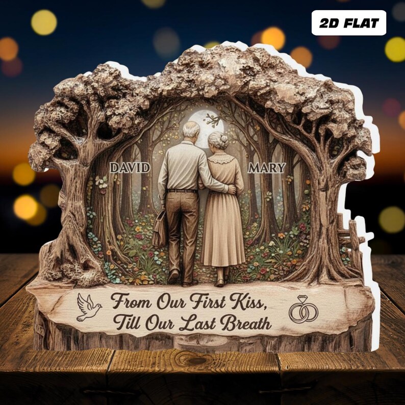 May include: A decorative wooden plaque featuring a couple standing in a forest scene, with the names "DAVID" and "MARY" above them. The plaque includes the text "From Our First Kiss, Till Our Last Breath" and a dove illustration. The background is a night scene with a full moon.