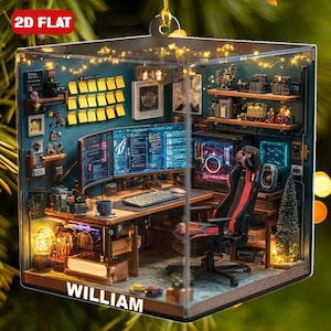 May include: A 2D flat Christmas ornament featuring a miniature computer setup. The ornament includes a desk, multiple monitors displaying code, a gaming chair, and decorative items. The name "WILLIAM" is displayed on the front. The ornament is encased in a clear cube.