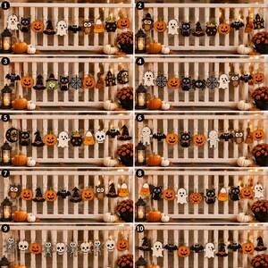 May include: A collection of ten distinct Halloween-themed felt garlands featuring various shapes including ghosts, black cats, pumpkins, owls, bats, witches' hats, spiders, webs, cauldrons, candy corn, and skeletons, all strung on twine for decoration.