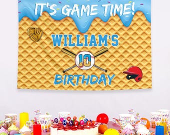 May include: A baseball-themed birthday banner with the text "IT'S GAME TIME!" and "WILLIAM'S 10 BIRTHDAY" in blue. The banner features a baseball, bats, a glove, and a helmet on a waffle-textured background.