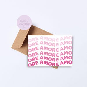 May include: A pink and white printable card with the text "ORE AMORE AMO" repeated in a gradient pattern.