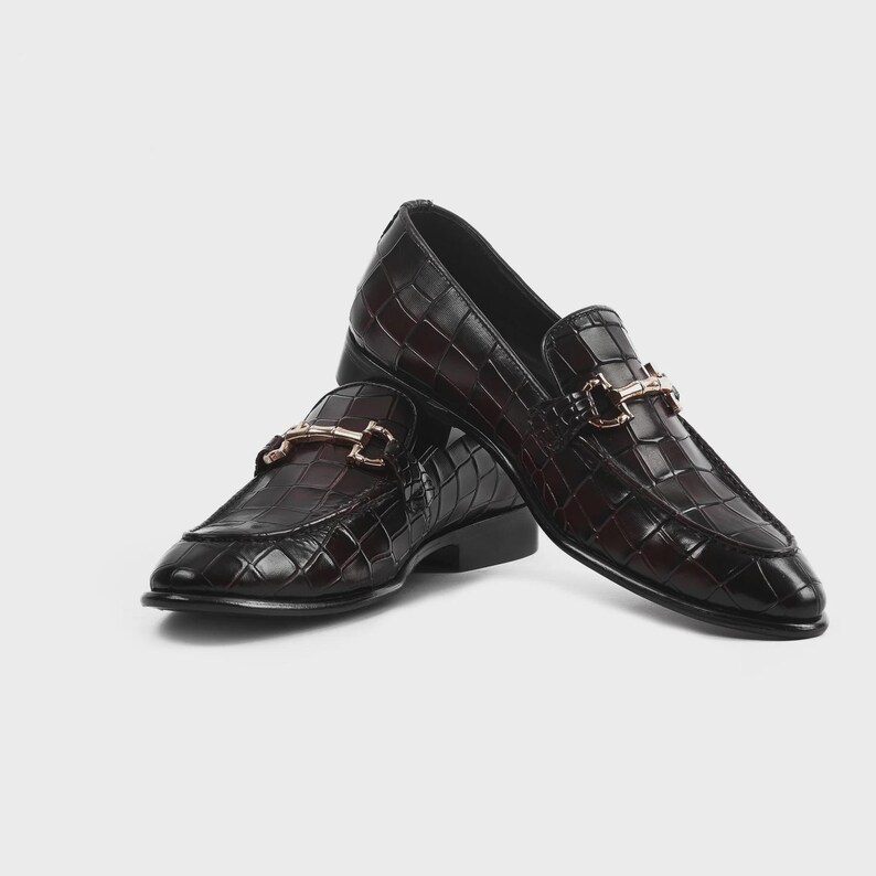 Handmade croc embossed leather horsebit loafers for men featuring a luxurious dark brown finish, polished metal horsebit detail, premium leather construction, slip-on design, and elegant formal styling suitable for weddings, business attire, parties, and special occasions.