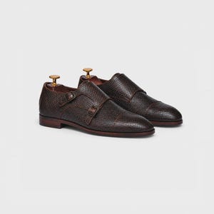 Handmade brown double monk strap shoes for men featuring snake embossed leather texture, cap toe design, dual buckle closure, leather lining and sole, luxury formal footwear ideal for weddings, business attire, office wear, and special occasions.
