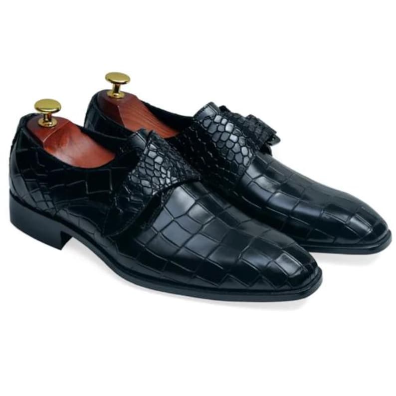 Handmade black crocodile embossed leather monk strap loafers for men featuring a textured buckle strap, premium leather lining, elegant slip-on design, and luxury craftsmanship for weddings, office wear, business meetings, and formal occasions.