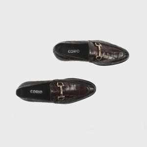Handmade croc embossed leather horsebit loafers for men featuring a luxurious dark brown finish, polished metal horsebit detail, premium leather construction, slip-on design, and elegant formal styling suitable for weddings, business attire, parties, and special occasions.