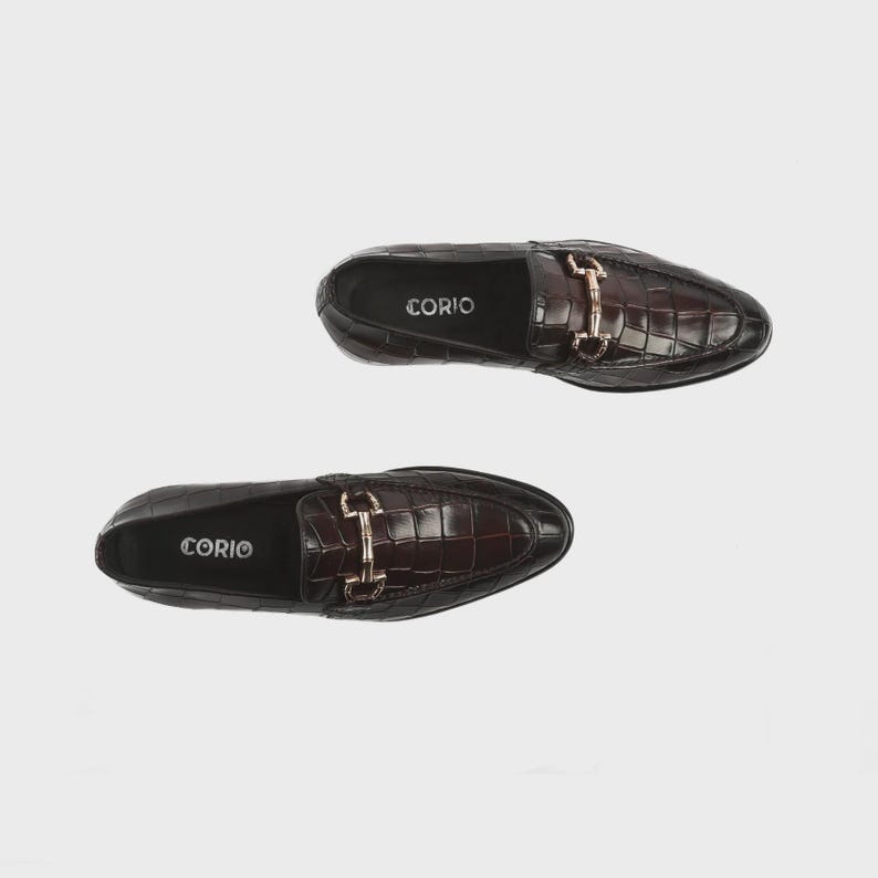 Handmade croc embossed leather horsebit loafers for men featuring a luxurious dark brown finish, polished metal horsebit detail, premium leather construction, slip-on design, and elegant formal styling suitable for weddings, business attire, parties, and special occasions.