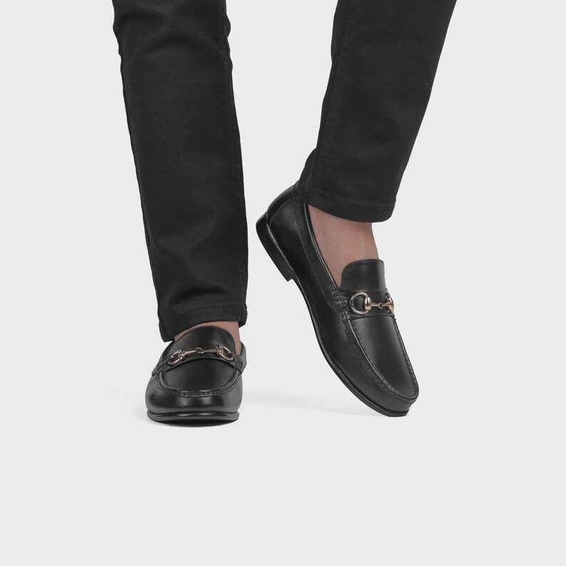 Handmade black leather horsebit loafers for men featuring polished premium leather and silver-tone hardware, luxury slip-on dress shoes ideal for weddings, groom attire, office wear, business meetings, formal events, parties, and sophisticated gentleman style.
