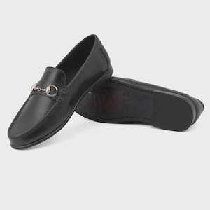 Handmade black leather horsebit loafers for men featuring polished premium leather and silver-tone hardware, luxury slip-on dress shoes ideal for weddings, groom attire, office wear, business meetings, formal events, parties, and sophisticated gentleman style.