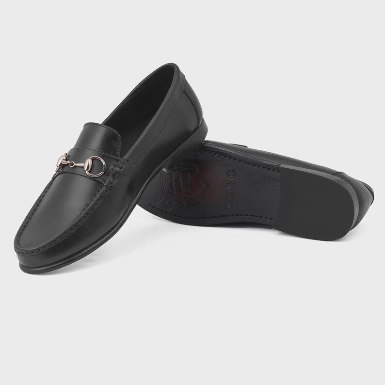 Handmade black leather horsebit loafers for men featuring polished premium leather and silver-tone hardware, luxury slip-on dress shoes ideal for weddings, groom attire, office wear, business meetings, formal events, parties, and sophisticated gentleman style.