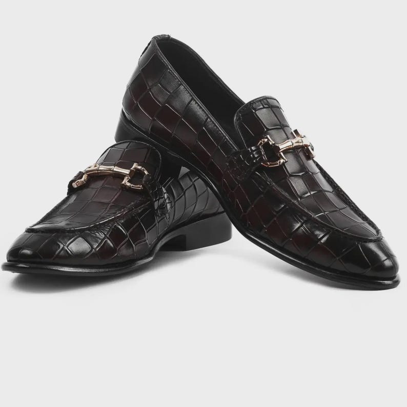 Handmade croc embossed leather horsebit loafers for men featuring a luxurious dark brown finish, polished metal horsebit detail, premium leather construction, slip-on design, and elegant formal styling suitable for weddings, business attire, parties, and special occasions.