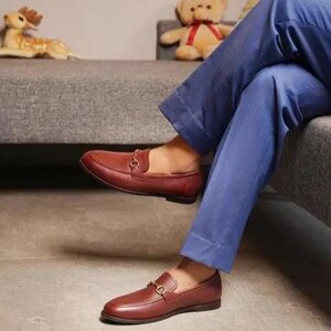 Handmade brown pebbled leather horsebit loafers for men featuring silver hardware, genuine leather lining, slip-on construction, and a luxury formal dress shoe design.