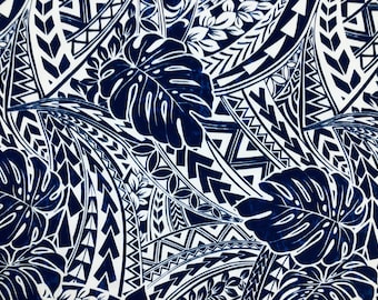 May include: A white fabric with a blue and white patterned design. The pattern features tropical leaves and geometric shapes.