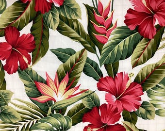 May include: A white fabric with a tropical print featuring red hibiscus flowers, green leaves, and pink bird of paradise flowers.