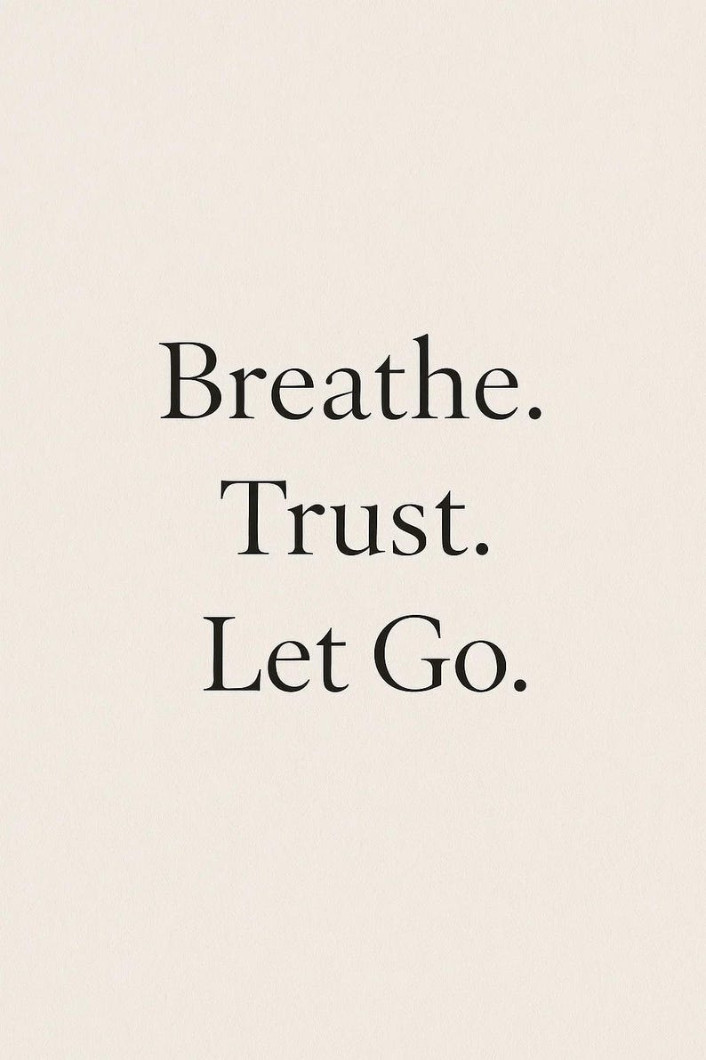 May include: A minimalist design with the words "Breathe. Trust. Let Go." in a simple, elegant font. The text is in black against a cream-colored background, creating a calming aesthetic.