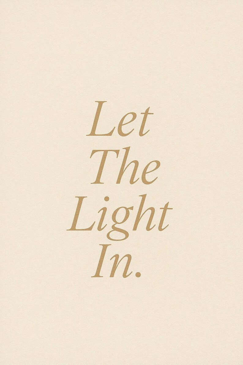 May include: A beige background with the words "Let The Light In" in a gold serif font. The text is centered and vertically aligned, creating a simple and elegant design.