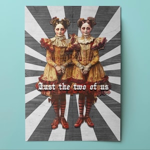 May include: A vintage-style print featuring two figures in matching antique dresses with ruffled collars and cuffs. The figures stand against a black and white striped background. The text "Just the two of us" is displayed across the bottom.