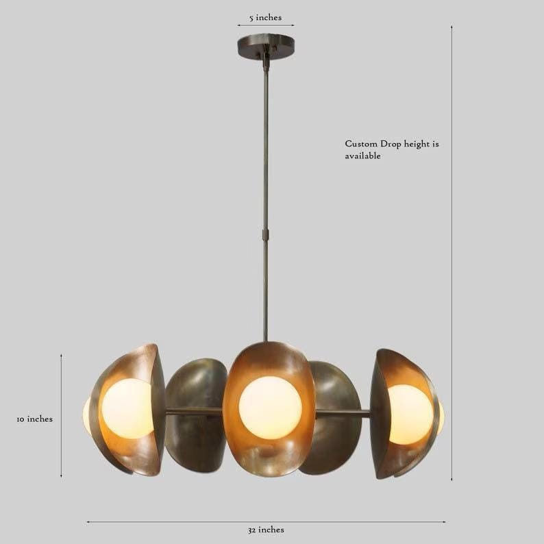May include: A modern, brass chandelier with five light bulbs. The chandelier is 32 inches wide and 10 inches tall. Custom drop height is available.