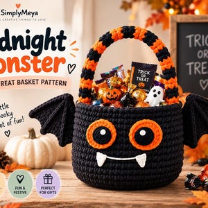 May include: A black crochet treat basket featuring orange and black striped handles, two black bat wings on the sides, and a monster face with large orange eyes and white fangs. The basket is filled with assorted candies and a small ghost figure.