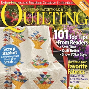 May include: A magazine cover for "Quilting" magazine, featuring a quilt with a patchwork design of baskets made from colorful fabric scraps. The cover text reads "101 Top Tips From Readers" and "Showcase Your Favorite Fabrics".