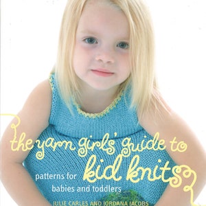 May include: A book titled "The Yarn Girl's Guide to Kid Knits" with a photo of a young girl wearing a blue knitted dress with a yellow trim. The book features patterns for babies and toddlers.