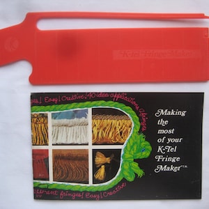 May include: A red plastic K-Tel Fringe Maker tool with a black and white card showing different types of fringe and the text "Making the most of your K-Tel Fringe Maker".