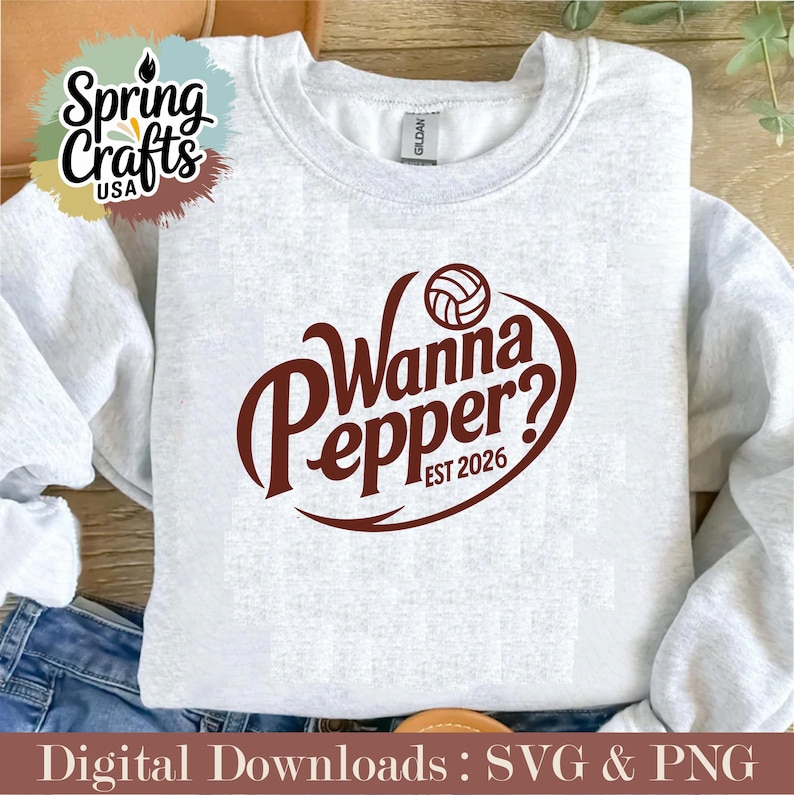 May include: A light gray sweatshirt with the text "Wanna Pepper? EST 2026" in a brown, stylized font, with a volleyball graphic. The sweatshirt has a crew neck and long sleeves. The image also includes the text "Digital Downloads : SVG & PNG".