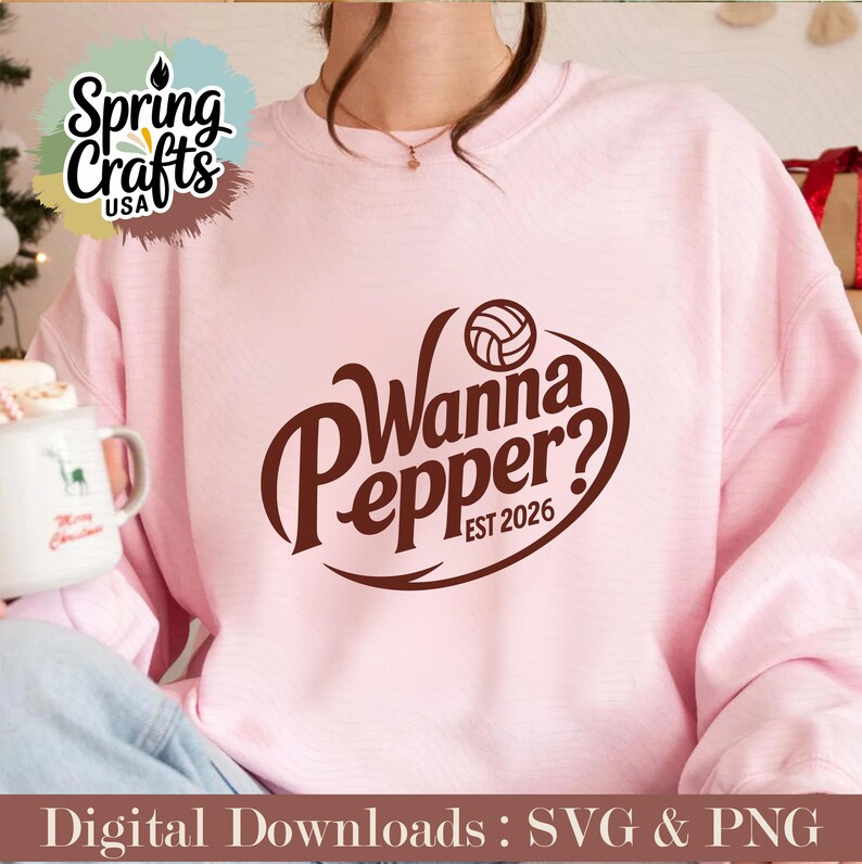 May include: A light pink sweatshirt with the text "Wanna Pepper? EST 2026" in brown. The design includes a volleyball. The image also shows a mug with a reindeer design and the words "Merry Christmas". The sweatshirt is part of a digital download.