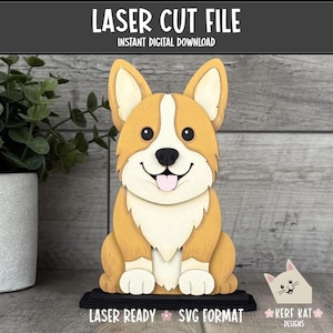 Può includere: Statuetta di cane corgi in legno tagliata al laser. Il cane è marrone chiaro e bianco con un naso nero e un viso sorridente. La statuetta poggia su una base nera. Il testo recita "LASER CUT FILE" e "INSTANT DIGITAL DOWNLOAD".