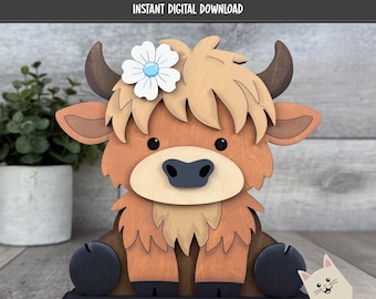 May include: A wooden laser-cut Highland cow figurine with a flower on its head. The cow is brown, tan, and black, with a flower that has a blue center. The text "LASER CUT FILE" and "INSTANT DIGITAL DOWNLOAD" are at the top. The text "LASER READY SVG FORMAT" is at the bottom.