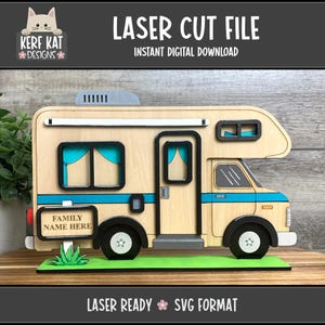 May include: A wooden laser-cut camper with black wheels, a blue stripe, and teal window curtains. The sign reads "FAMILY NAME HERE". The top banner says "LASER CUT FILE INSTANT DIGITAL DOWNLOAD". The bottom banner says "LASER READY SVG FORMAT".