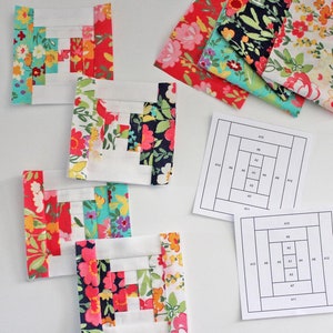 Könnte beinhalten: Vier Stoffquadrate mit einem Blockhausmuster in Rot-, Weiß-, Blau-, Grün- und Rosatönen. Die Quadrate sind in einer Reihe angeordnet. Unter den Quadraten befinden sich zwei Diagramme mit Rastermustern, die mit A1 bis A12 und B1 bis B12 beschriftet sind.