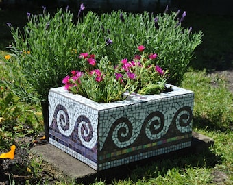 Upcycled mosaic cinder block garden planter-purple tile and white glass wave motif