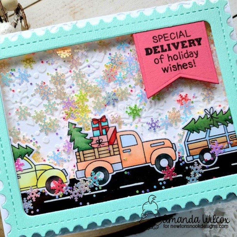May include: A festive holiday card with a light blue scalloped frame. Inside, a scene of colorful snowflakes and three cartoon vehicles carrying gifts and Christmas trees. A pink banner reads "SPECIAL DELIVERY of holiday wishes!"