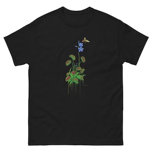 May include: Black t-shirt with a graphic of a Venus flytrap plant with a blue flower and a bee.
