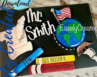 May include: A black chalkboard sign with the text "Mr. Smith" and a globe with an American flag pin. The sign also includes a quill pen, a scroll, and three books labeled "1776", "US History", and "American History".