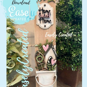 Peut inclure: Panneau décoratif en bois avec le texte « Home Sweet Home ». Le panneau présente une maison, des cœurs et un seau. Les mots « Easely Created » et « Instant Digital Download » sont également visibles.