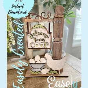 May include: Wooden sign with the text "Welcome to our coop" and a chicken silhouette. The sign is attached to a wooden post with a decorative scrollwork top. There are also wooden eggs and a basket in the image.