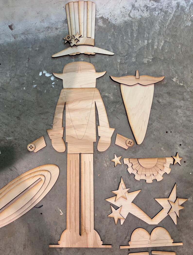 May include: A wooden craft kit to assemble a Uncle Sam figure. The kit includes pieces for the body, hat, beard, stars, and a banner.