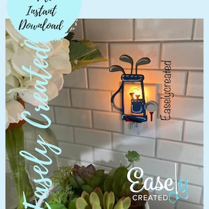 May include: A blue and white golf bag night light plugged into an electrical outlet. The light is on and illuminating the surrounding area. The text "Easley Created" is visible on the wall.