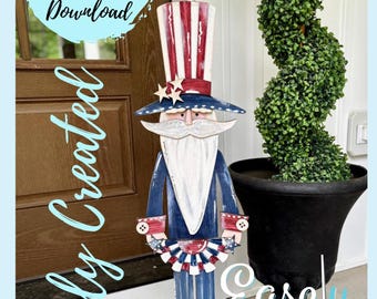 May include: A wooden cutout of a patriotic Uncle Sam figure with a red, white and blue hat, beard and clothing. He is holding a red, white and blue fan in his hands. The figure is standing on a base with stars and stripes. The text "Easily Created" is written in blue on the left side of the image and "Easley Created" is written in blue on the right side of the image.