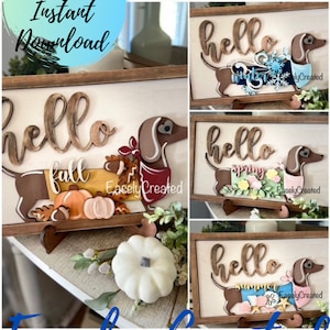 May include: Four wooden signs featuring a dachshund dog and the words "hello fall", "hello winter", "hello spring", and "hello summer".