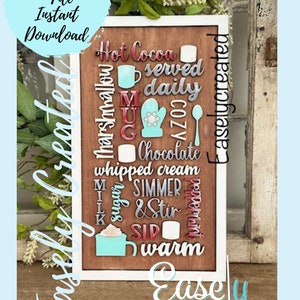 May include: A wooden sign with the words "Hot Cocoa" and other related words in a decorative font. The sign is painted in shades of red, white, and blue. The words "Easely Created" are printed at the bottom of the sign.