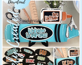 May include: A blue and white crayon-shaped sign with the text "Welcome to our class". The sign is decorated with a black chalkboard-style glue bottle with the text "Mrs. Hoffman". There are also several oval-shaped black chalkboard signs with various text, including "Music Day", "BOO", "Spring", "Welcome", "Fall", "Happy Holidays", "DE Day", and "Luck".