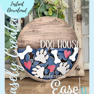 May include: A wooden round sign with the text "DOG HOUSE" in white lettering. The bottom half of the sign is painted blue with white paw prints, bones, and red hearts.