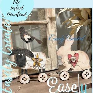 May include: A digital cut file for a wooden toy lamb and bunny pull toy. The lamb is black and white with a yellow star and a bird on top. The bunny is white with a red heart. Both toys have wooden wheels. The text "Easly Created" is on the image.